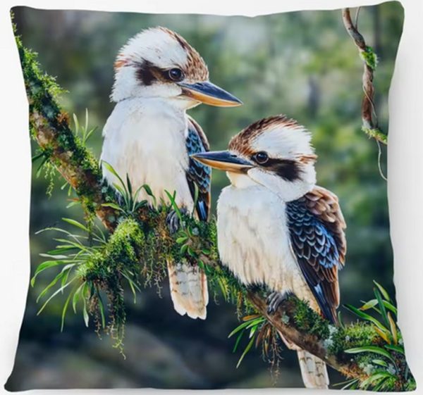 Two kookaburras perched on branch on cushion cover