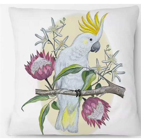 Cushiom cover with a Cockatoo perched on floral branch.