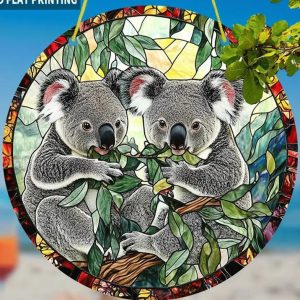 Sun Catcher with Two koalas eating eucalyptus leaves.